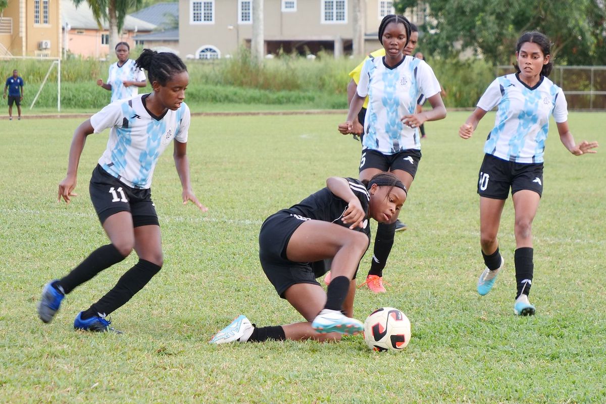 Nikita Gosine of Pleasantville Secondary School attempted to control the ball while being encircled by players from St Joseph Convent San Fernando during an SSFL Girls Championship Division football match at Mannie Ramjohn Stadium, Marabella on Thursday, October 26th 2023. PHOTO BY: Kristian De Silva