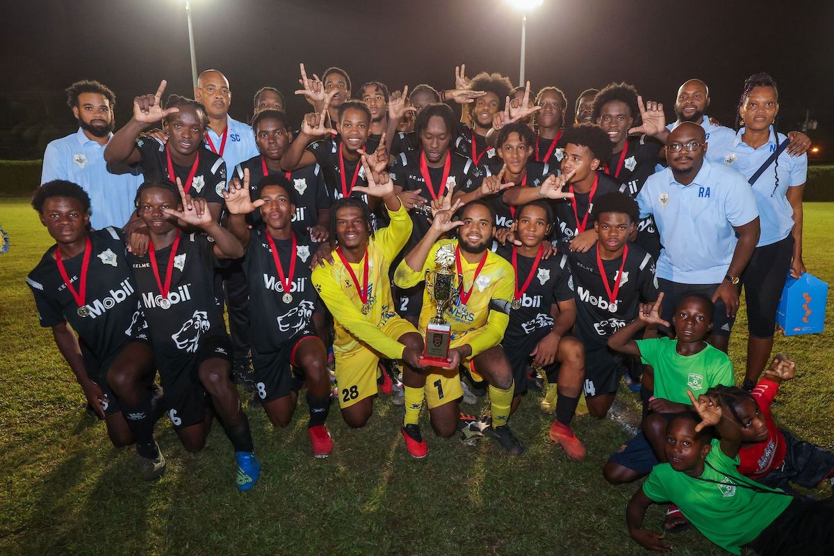 Presentation College of San Fernando players celebrate after they were crowned champion in the South Zone of the Coca-Cola Intercol tournament after a 1-0 victory over St Benedict’s College at the Mahaica Sporting Complex, Point Fortin on Friday, March 24th 2023. PHOTO BY: Daniel Prentice