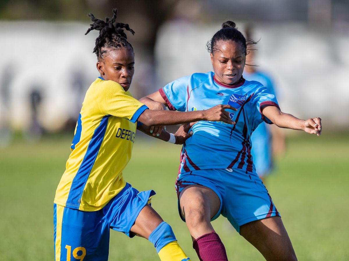 Aaliyah Prince of Defence Force FC women vie for possession with QPCC FC women Anushka Villaruel during the TTWOLF Ascension Tournament match between QPCC FC Women and Defence Force FC Women at the CIC Grounds in Port-of-Spain on July 30th 2022. The Match ended in a 3-3 draw. PHOTO: Daniel Prentice