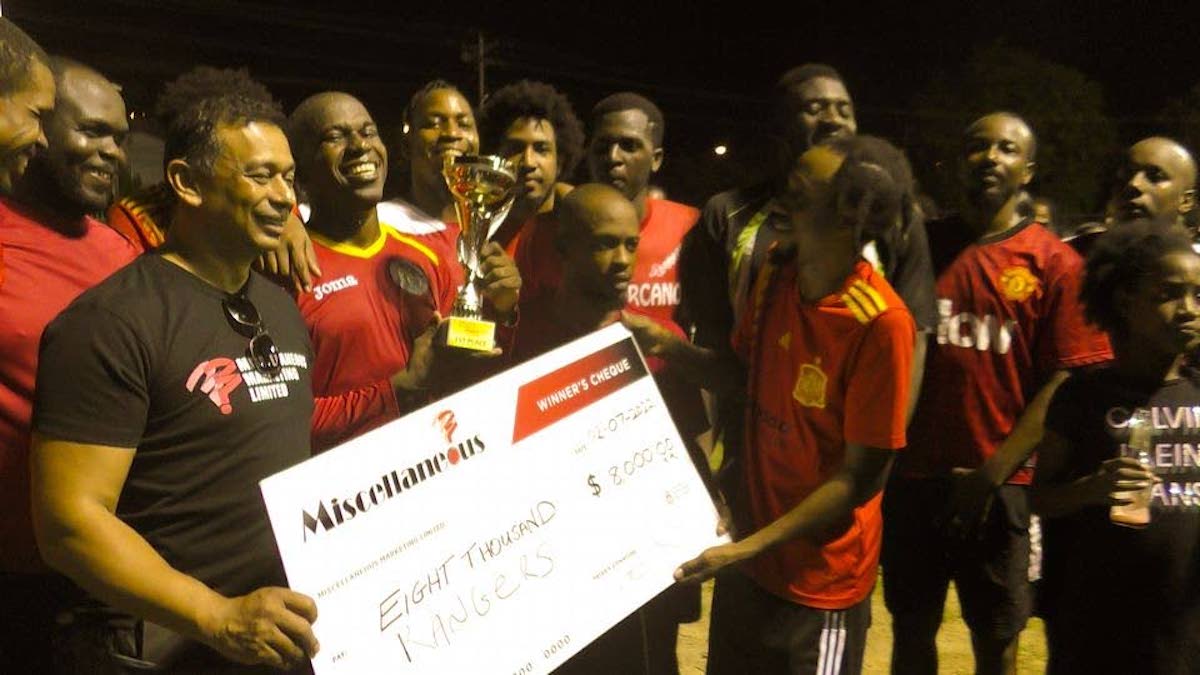 Miscellaneous CEO Sham Mohammed (left), presents the winners' cheque to the Rangers players following their 1-0 win in the final of the Beetham Football 7s tournament at Beetham Gardens Recreation Ground on July 2nd 2022.