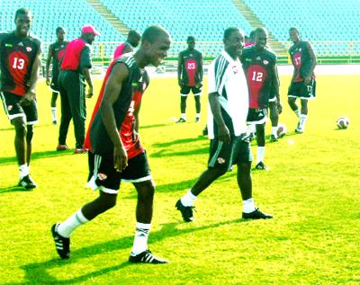 Soca Warriors coach Russell Latapy, right, shares a joke with defender Robert Primus during a national team closed door training session at Hasely Crawford Stadium, Mucurapo, yesterday. Photo Courtesy T&TFF.