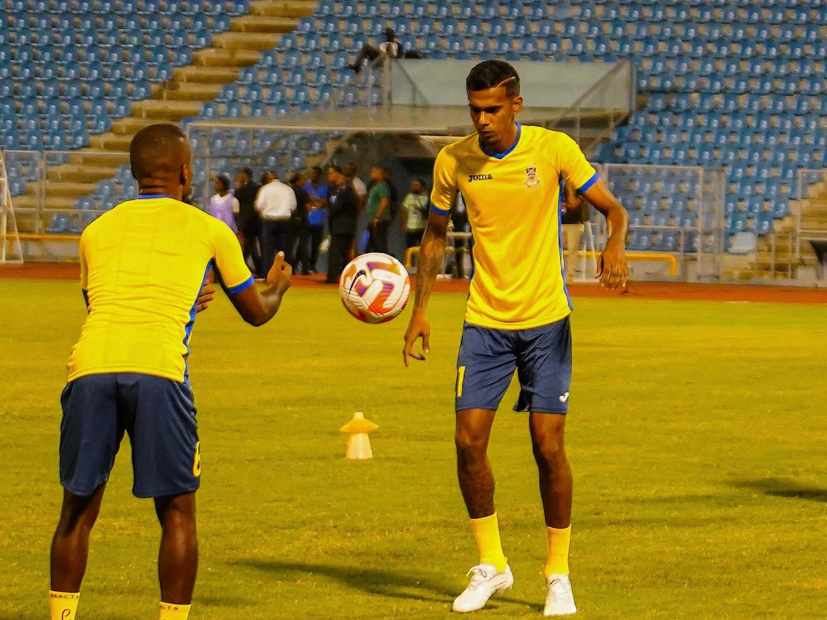 Defence Force's Justin Sadoo (right) warms up before facing Cavalier FC of Jamaica in a Concacaf Caribbean Cup match at the Hasely Crawford Stadium on August 24th 2023.