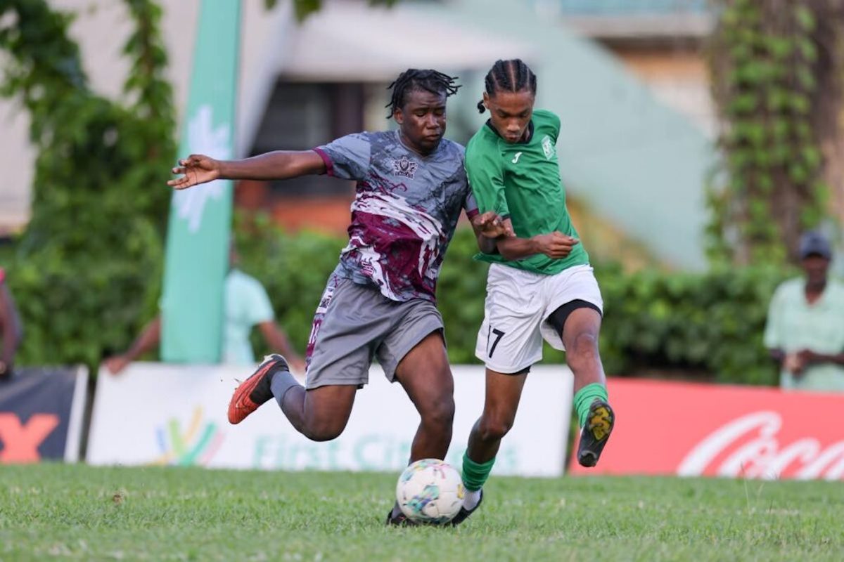 San Juan North Secondary's Jahdel Chase-Charles (R) and Bishop’s High’s Adriano Murray vie for possession during the Secondary School Football League Premiership match at the San Juan North Secondary Ground, San Juan on Saturday, October 7th 2023. PHOTO BY: Daniel Prentice