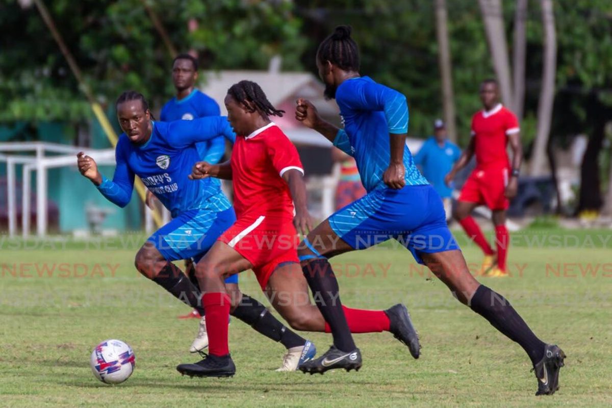Two Sidey's FC players track the run of a Charlotteville Police Youth Club player in their Tobago Ascension Premier League match at Speyside Recreation Ground on Sunday. Photo by David Reid