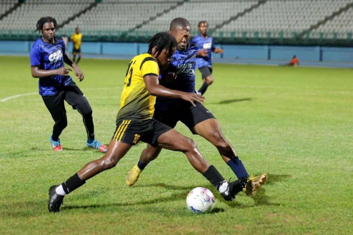 A Sidey's FC player shields the ball from his Golden Lane opponent in the TFA knockout semis at Dwight Yorke Stadium, Bacolet, Tobago on Saturday, September 23rd 2023.