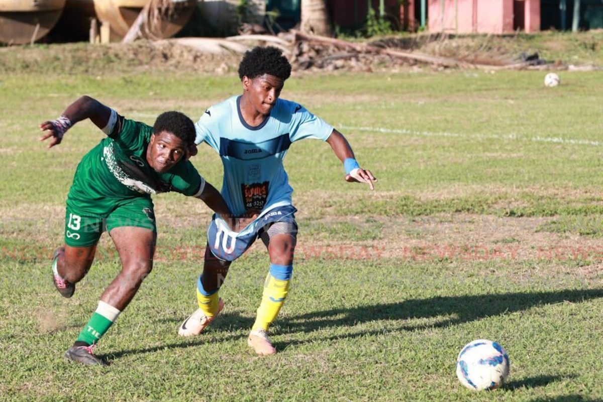 A St Augustine player tussles with his El Dorado East rival for the ball in a Secondary Schools Football League East Zone Championship match, at St Augustine Secondary ground, Tuesday, October 10th 2023. PHOTO: Jeff K Mayers