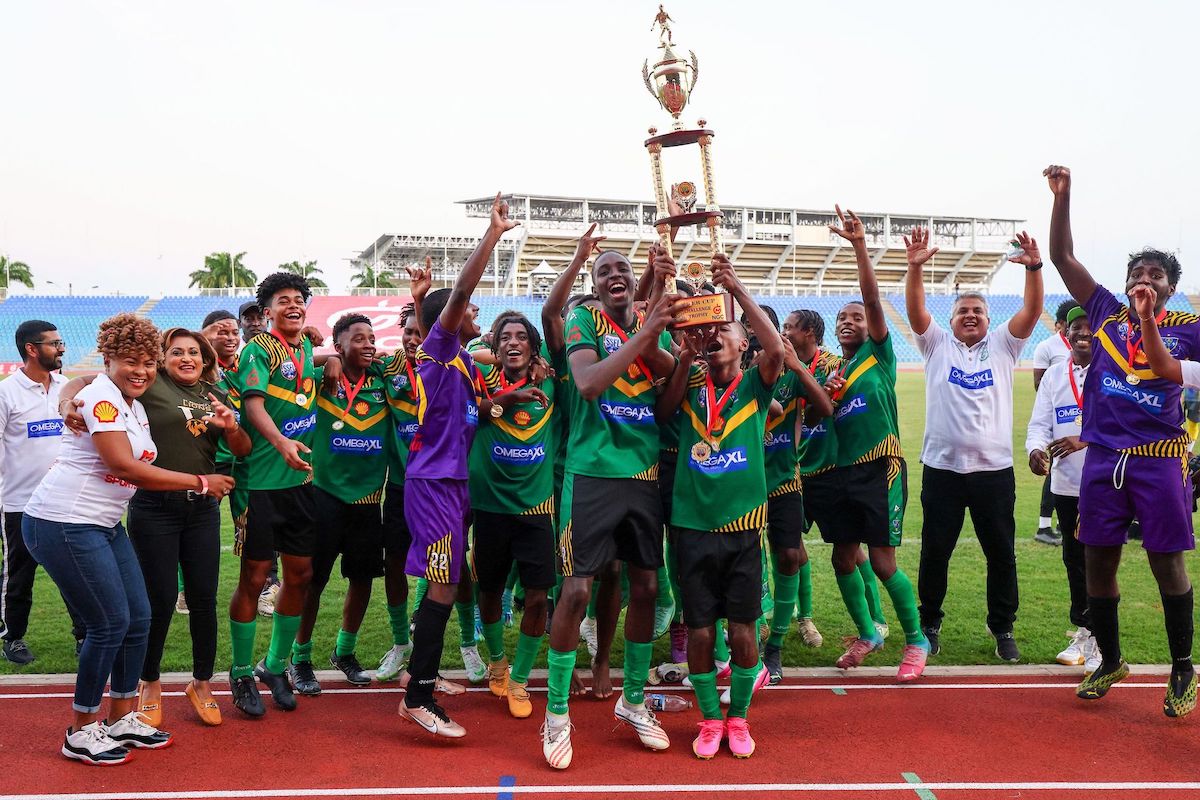 St Benedict's College footballers celebrate with trophy after defeating Fatima College to win the Secondary School Football League Super Cup at the Hasely Crawford Stadium in Mucurapo, Port-of-Spain on Saturday, September 9th 2023. St Benedict's won 4-3. PHOTO: Daniel Prentice