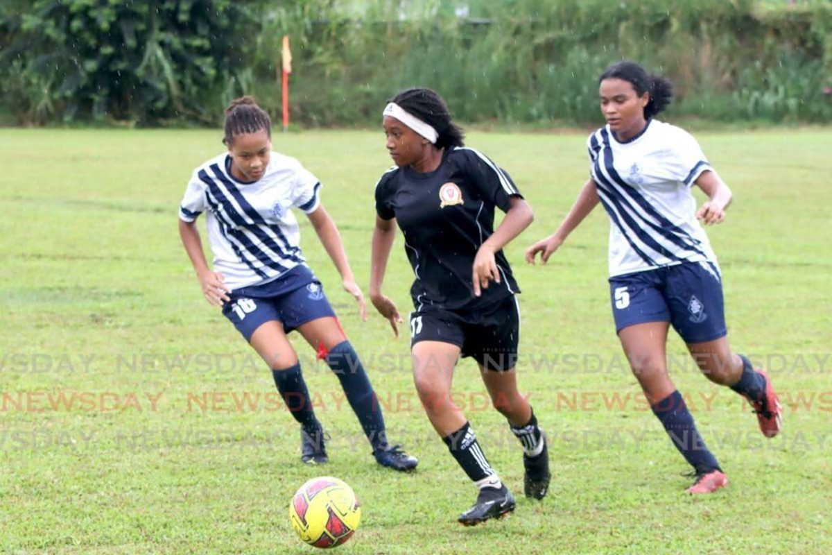 Pleasantville Secondary’s Maya Wong (C) controls the ball against pressure from St Joseph’s Convent Port of Spain players during the Girls Big Five match, on Thursday, November 2nd 2023 at St Joseph’s Convent grounds, Port of Spain.