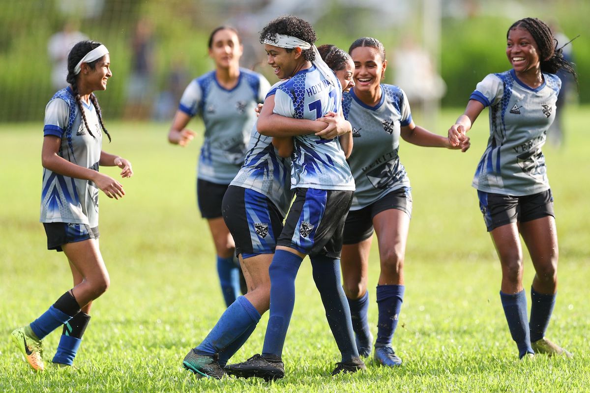 Players of Holy Name Convent celebrate with goalscorer Jessica Harragin, centre, during the Secondary School Football League Girls Championship match against St Joseph’s Convent Port-of-Spain. The match was played at the St Joseph’s Convent Grounds, at Federation Park, Port-of-Spain on Thursday October 20th 2022. Holy Name Convent won 3-2. PHOTO: Daniel Prentice