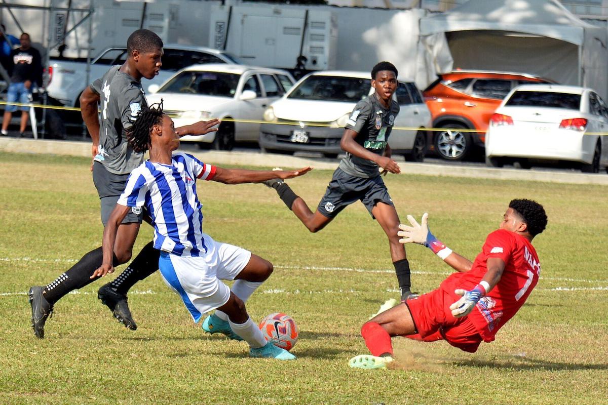 No goal: CIC’s captain, Kyle Phillip, slips before shooting at a relieved Naparima College goalie, Tyrece Romain, in the first half of their Secondary Schools Football League (SSFL) premier division match at St Mary’s College Ground, Serpentine Road, St Clair on Saturday, September 16th 2023. The match ended 3-2 in Naps’ favour. —Photo: ROBERT TAYLOR