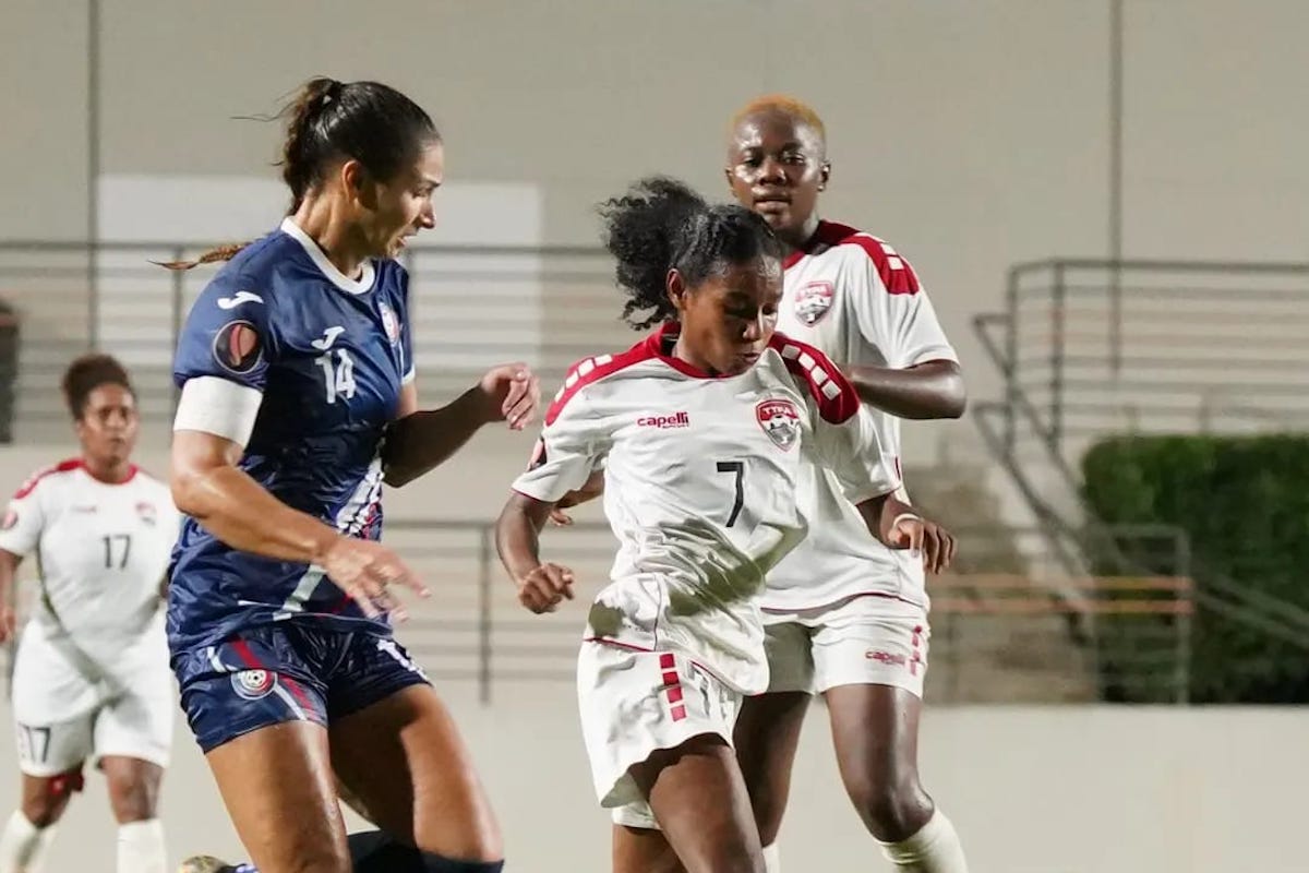 Jillienne Aguilera, left, the USA-based Chicago Red Stars and Puerto Rican captain, chases down Trinidad and Tobago midfielder Alexcia Ali, while team-mate Asha James, right, looks on as Puerto Rico and T&T drew 0-0 in a 2024 CONCACAF W Gold Cup qualifier on Tuesday, October 31st 2023 at the Juan Ramón Loubriel stadium in Bayamon, Puerto Rico.