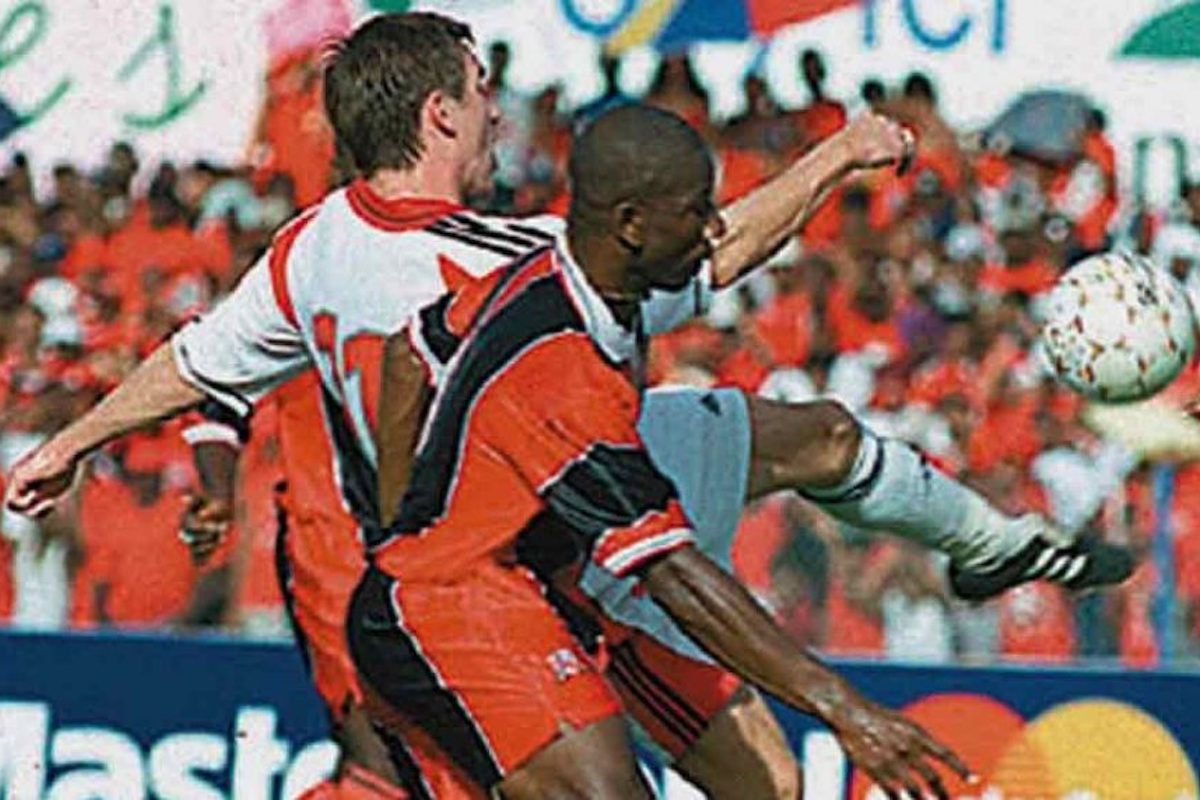 Canada's Jim Brennan, left, shields the ball from Trinidad and Tobago's Marvin Andrews during a World Cup qualifying match at the Queen's Park Oval in Port-of-Spain, Trinidad, Sunday, Sept. 3, 2000. Trinidad and Tobago won 4-0. THE CANADIAN PRESS/AP-Trinidad Express, Stephen Dooby