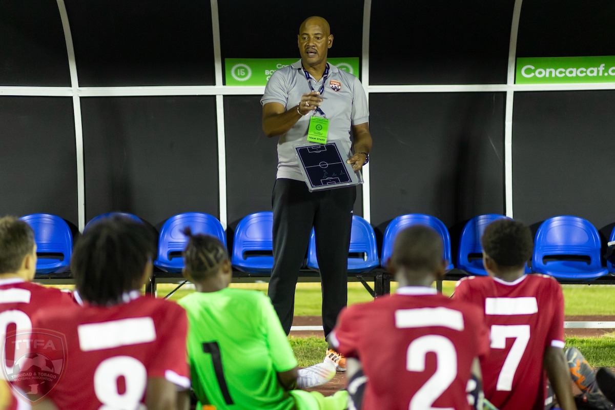 Trinidad and Tobago Boys U-15 Head Coach Shawn Cooper addresses the team at halftime of a game against Honduras at the Concacaf Boys U-15 Championship on August 6th 2023.
