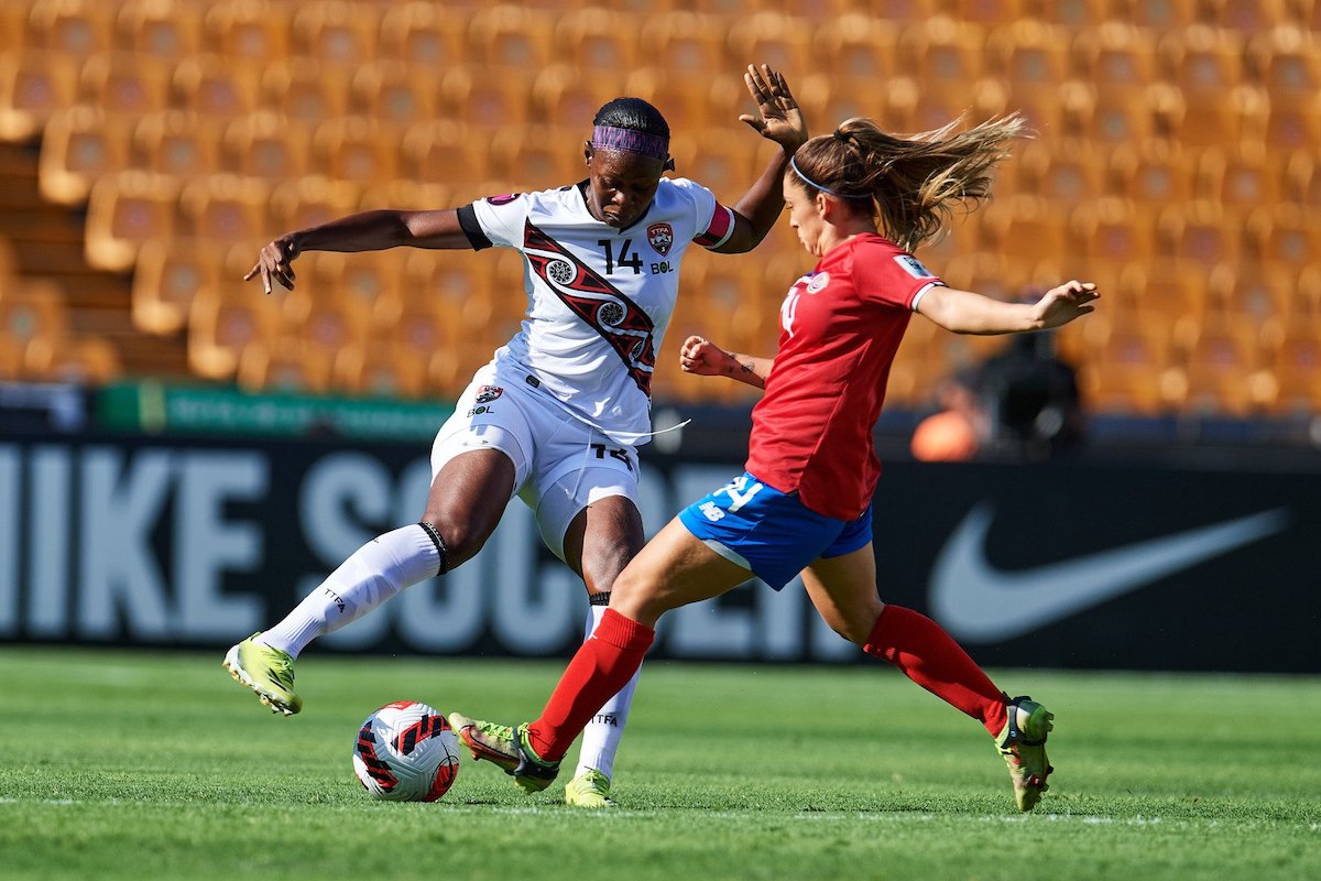 Trinidad and Tobago's Karyn Forbes (left) tries to evade a Panamanian player during a CONCACAF Women's Championship match in Monterrey, Mexico, on Monday, July 11th 2022