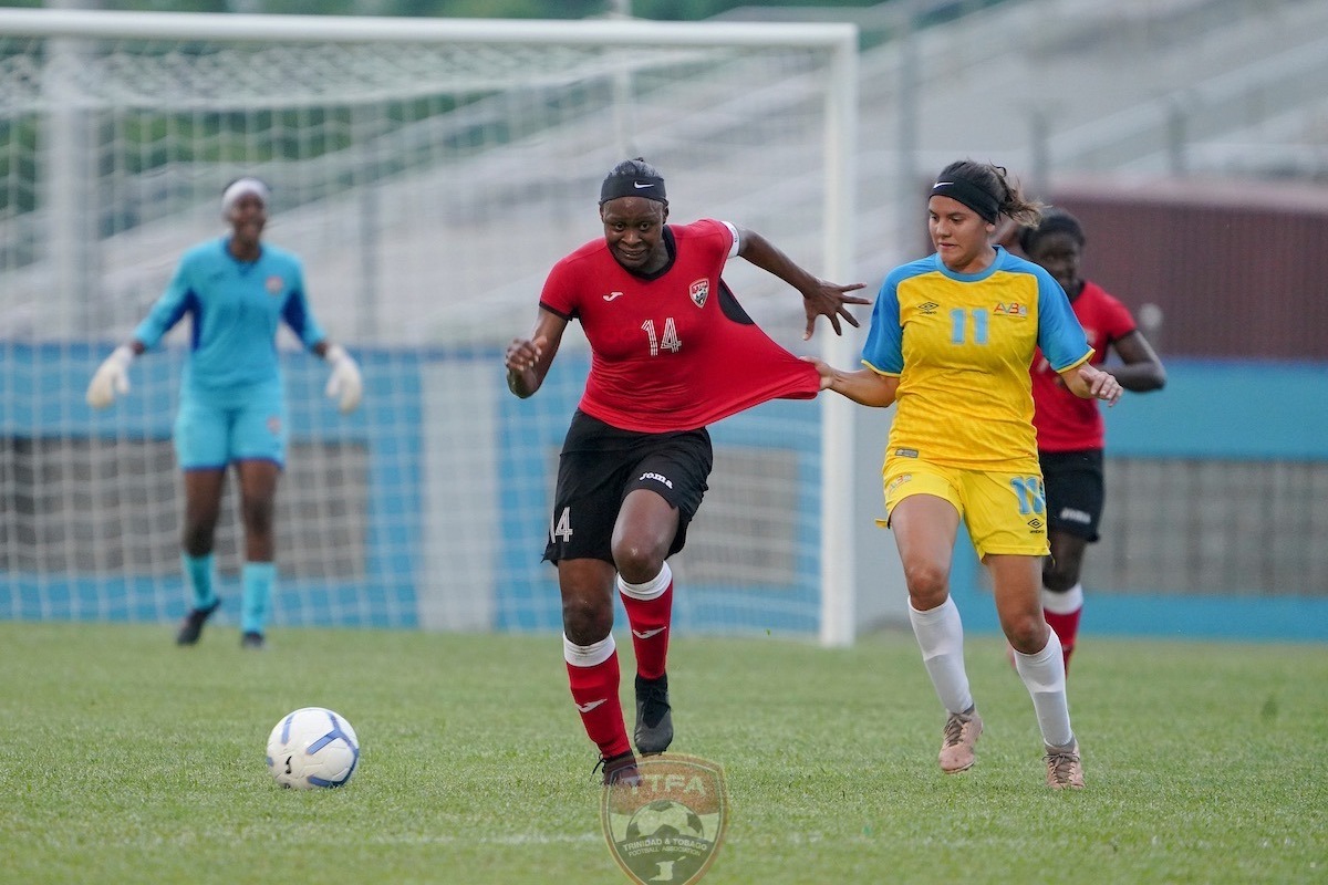 Trinidad and Tobago captain Karyn Forbes, goes on the attack as Josrine Saladin holds on to her top during their opening match of the Concacaf Women’s Olympics Qualifiers at the Ato Boldon Stadium in Couva on Monday, September 30th 2019.
