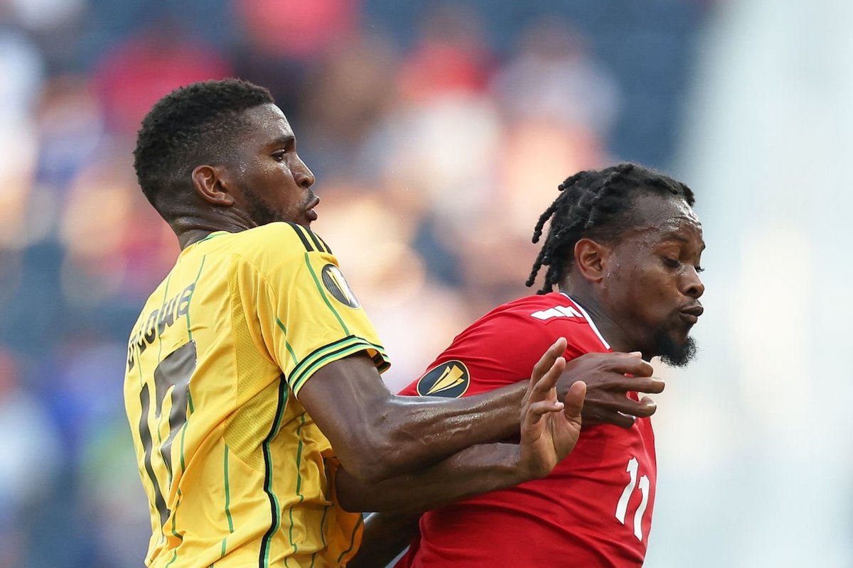 Levi Garcia #11 of Trinidad and Tobago and Damion Lowe #17 of Jamaica fight for the ball during a Group A match between Jamaica and Trinidad & Tobago as part of the 2023 CONCACAF Gold Cup at Citypark on June 28, 2023 in St Louis, Missouri. (Photo by Omar Vega/Getty Images)