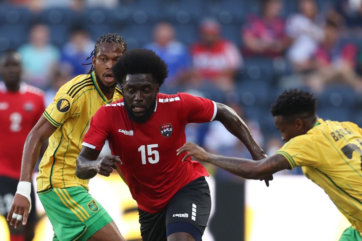 Neveal Hackshaw #15 of Trinidad and Tobago is marked by Javain Brown #21 of Jamaica during a Group A match between Jamaica and Trinidad & Tobago as part of the 2023 CONCACAF Gold Cup at Citypark on June 28, 2023 in St Louis, Missouri. (Photo by Omar Vega/Getty Images)