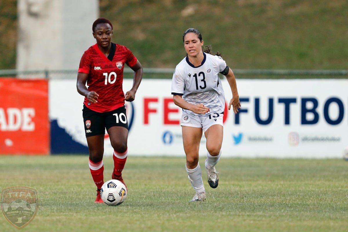Trinidad and Tobago's Asha James (left) challengers for the ball during an International Friendly against Dominican Republic at the Estadio Panamericano, San Cristóbal, Dominican Republic on Friday, November 26th 2021.