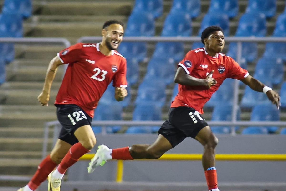 Trinidad and Tobago's Nathaniel James (#11) celebrates after scoring the winning goal against Curaçao in a Concacaf Nations League match at the Hasely Crawford Stadium on Thursday, September 7th 2023. Alongside him is midfielder Kristian Lee-Him (#23).
