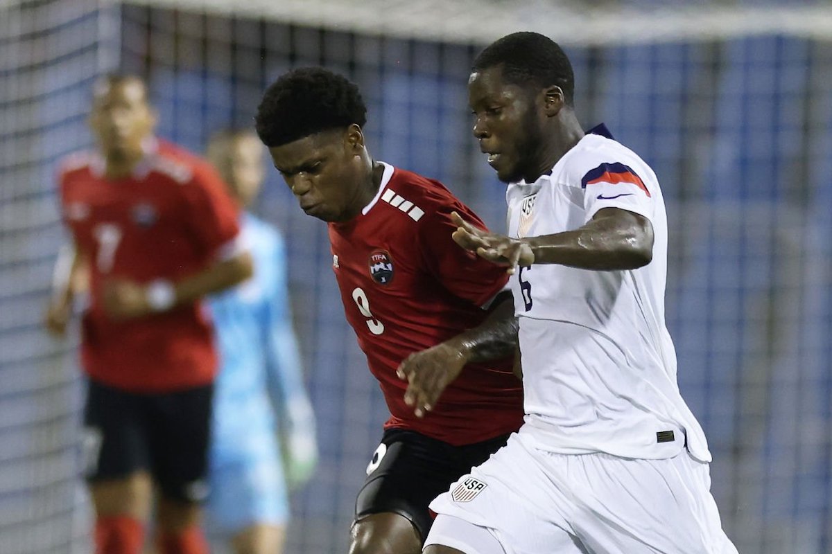 Yunus Musah #6 of the United States battles for the ball with Nathaniel James #9 of Trinidad and Tobago during the second half at Hasely Crawford Stadium on November 20, 2023 in Port of Spain, Trinidad And Tobago. (Photo by John Dorton/ISI Photos/USSF/Getty Images for USSF)