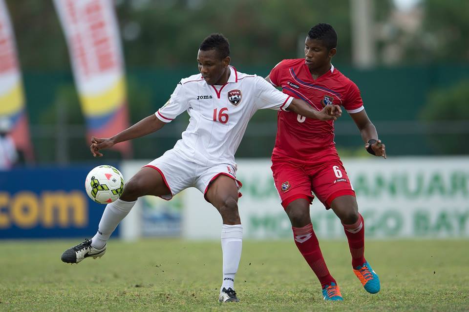 Ricardo John (#16) attempts to control the ball while under pressure from Fidel Escobar (#6) during a CONCACAF U-20 Championship match between Panama and T&T at Montego Bay Sports Complex, Montego Bay, Jamaica on Sunday, January 18th 2015.