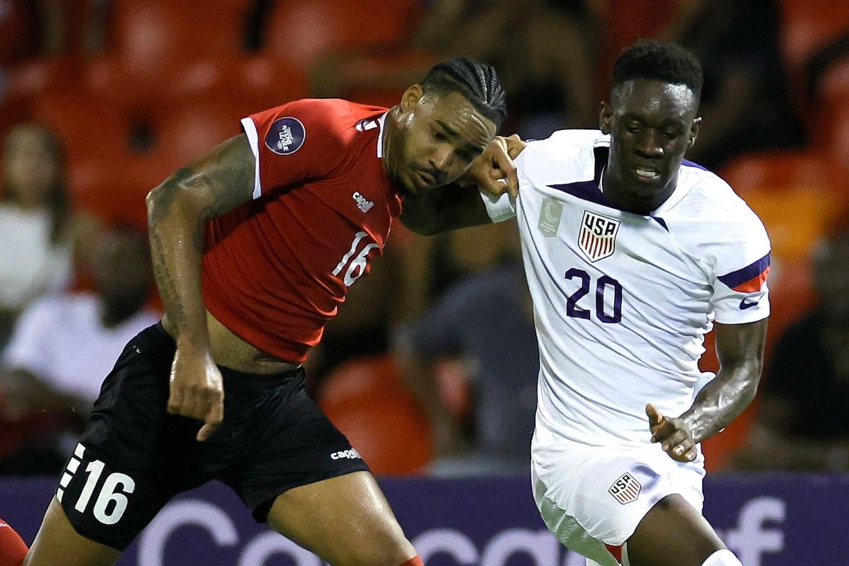 Alvin Jones #16 of Trinidad and Tobago battles for the ball with Folarin Balogun #20 of the United States during the second half at Hasely Crawford Stadium on November 20, 2023 in Port of Spain, Trinidad And Tobago. (Photo by Carmen Mandato/USSF/Getty Images for USSF)