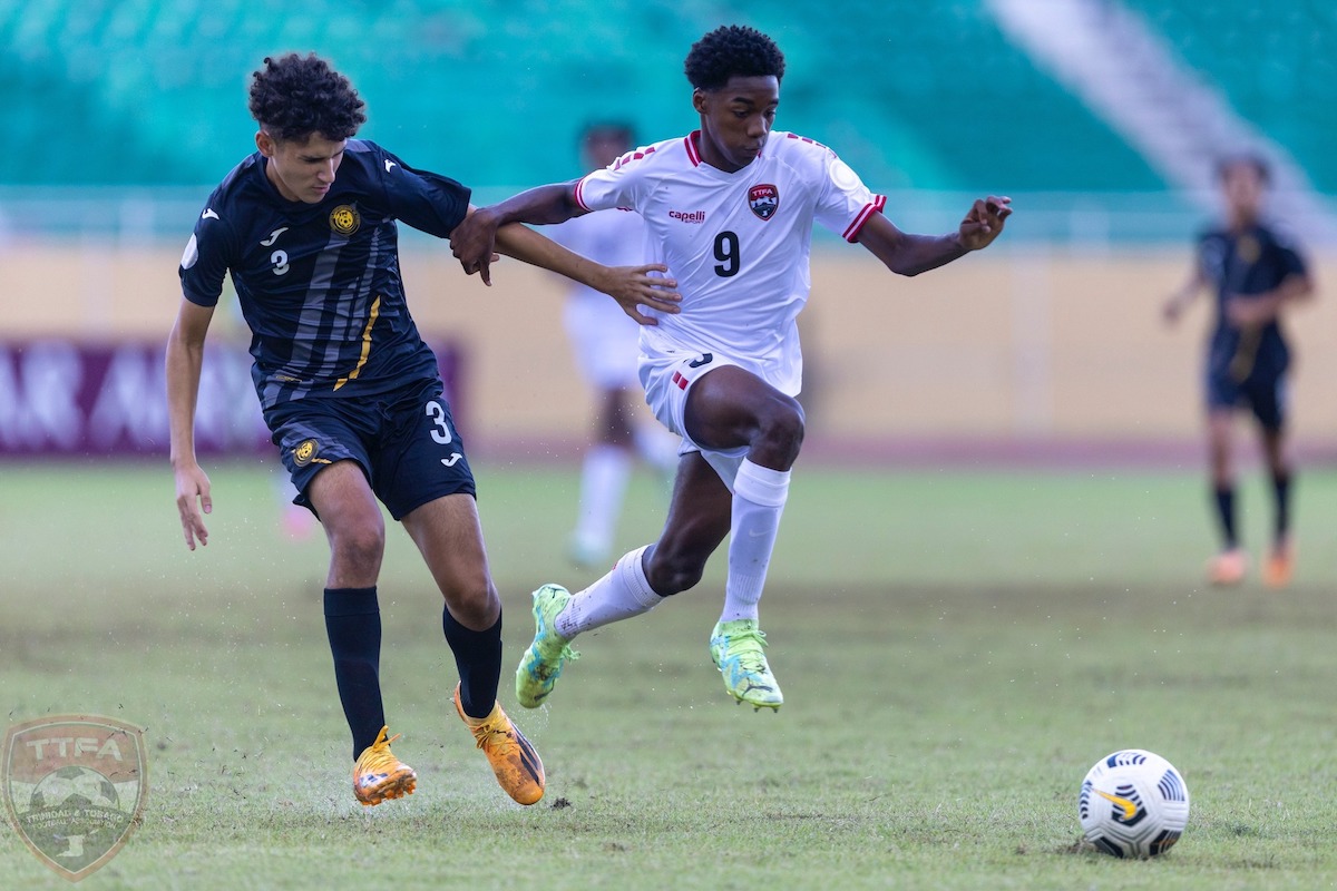 Trinidad and Tobago's Jonathan Mason (#9) skips past a Puerto Rican defender during a Concacaf Boys U-15 Championship match on August 8th 2023.