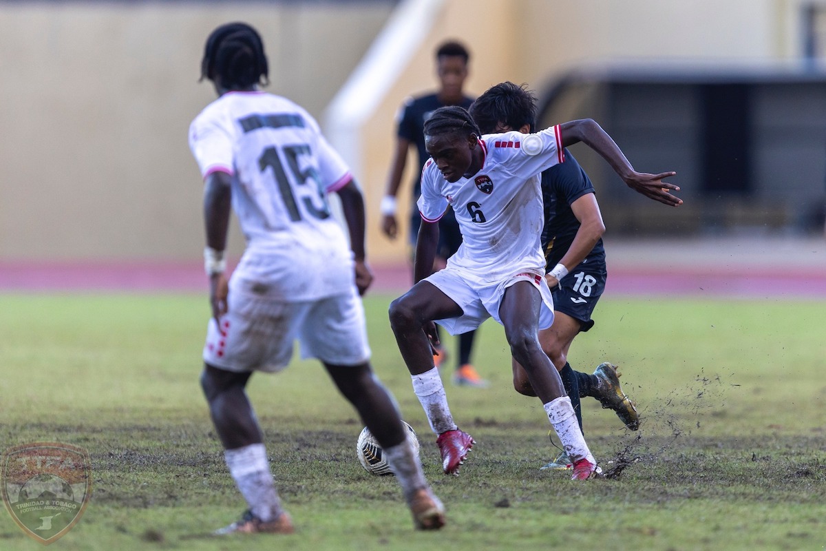 Trinidad and Tobago's Stephen Olliviere (#6) protects the ball from a Puerto Rican defender while Riquelme Phillips (#15) looks on during a Concacaf Boys U-15 Championship match on August 8th 2023.
