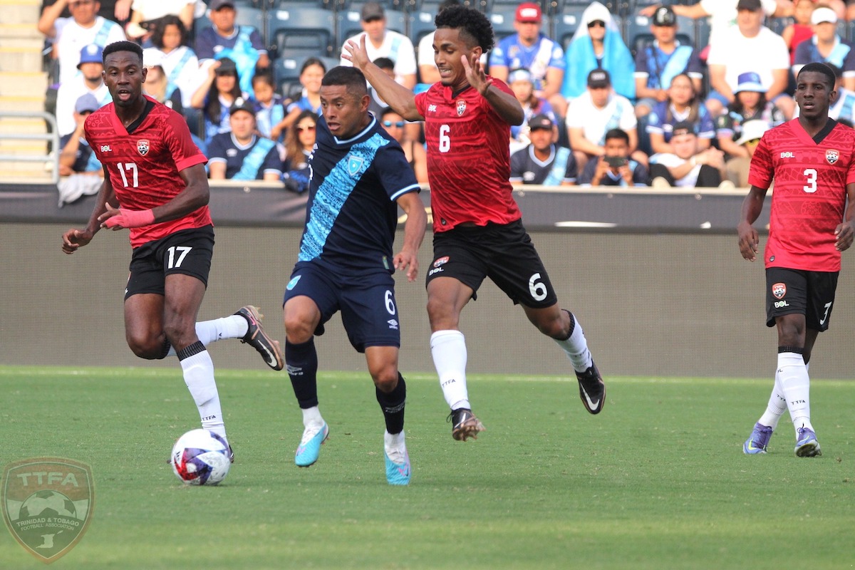 Trinidad and Tobago's Michel Poon-Angeron (middle) challenges Guatemala's Carlos Mejía (#6) for the ball during an International Friendly at Subaru Park, Chester, Pennsylvania on June 11th 2023.
