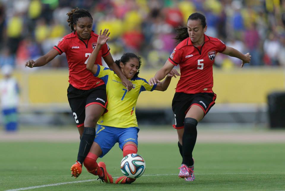 Trinidad and TobagoÂ’s Ayana Russell , left, and her teammate Arin King, close in on EcuadorÂ’s Ingrid Rodriguez, during a Women World Cup qualifying first leg soccer match, in Quito, Ecuador, Saturday, Nov. 8, 2014. Final score 0-0. (AP Photo/Dolores Ochoa)