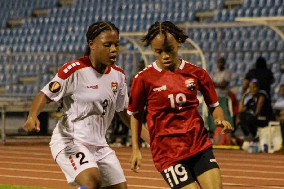 Trinidad and Tobago's Daneelyah Sandy (right) is challenged for the ball during a Jewels of the Caribbean  Women's U-17 Invitational Tournament match against the T&T 'B' team at Hasely Crawford Stadium, Port of Spain on Sunday, December 17th 2023.