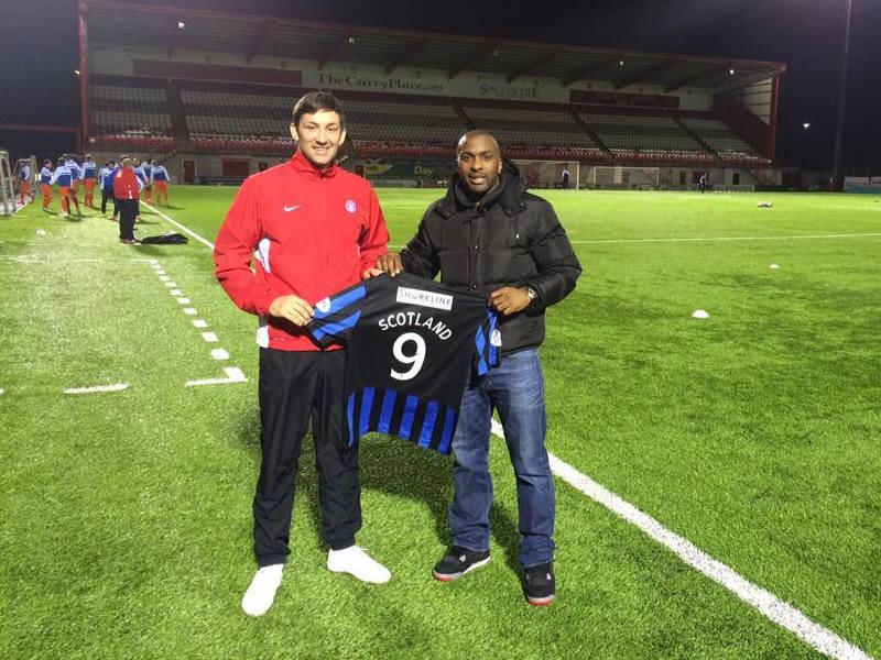 Hamilton manager, Martin Canning, poses with Jason Scotland as the striker re-signs for the club.