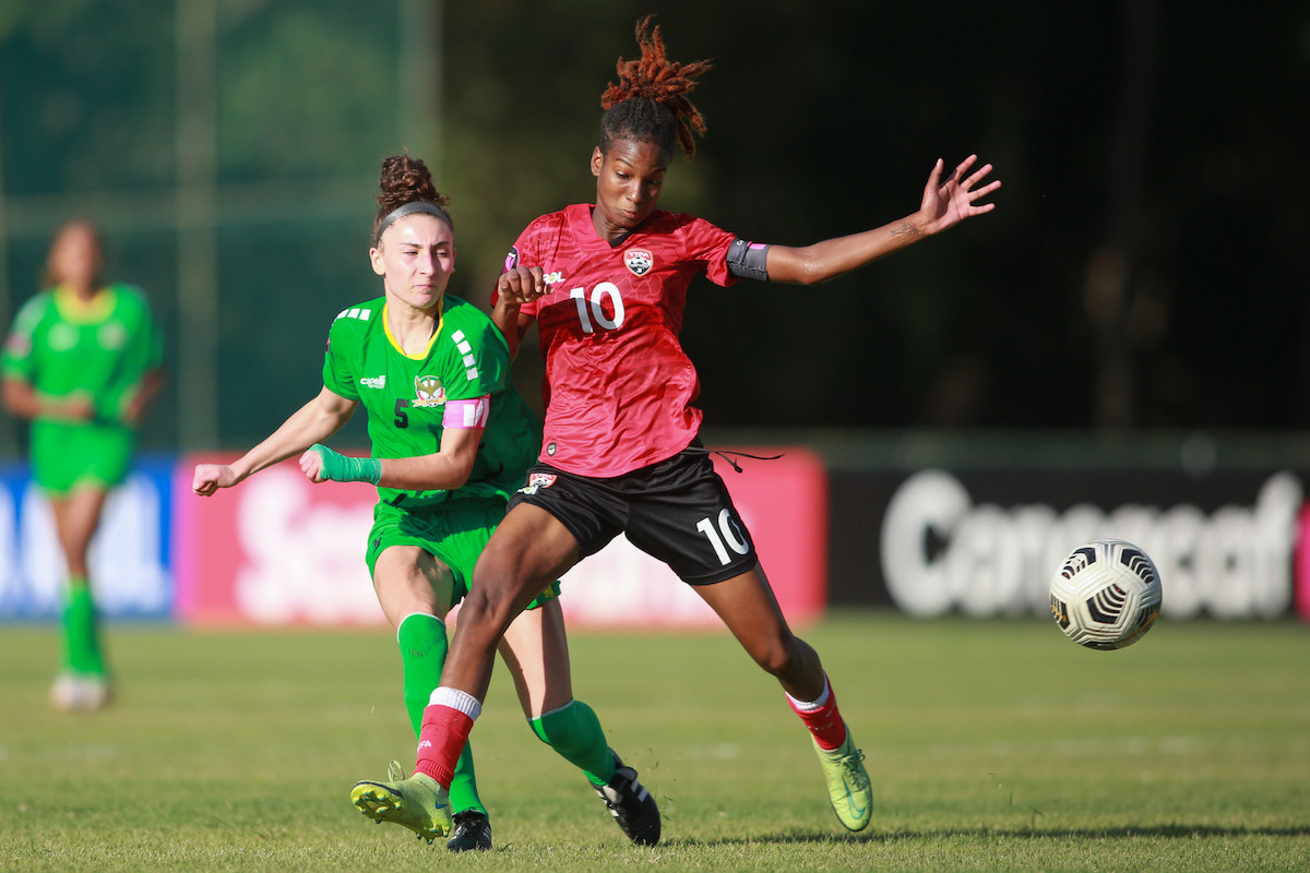 Trinidad and Tobago midfielder Maria-Frances Serrant (right) challenges for the ball during a 2022 Concacaf Women's U-20 Championship Group Stage match against St. Kitts and Nevis on Sunday February 27th 2022 at Estadio Pan Americano in San Cristobal, Dominican Republic.