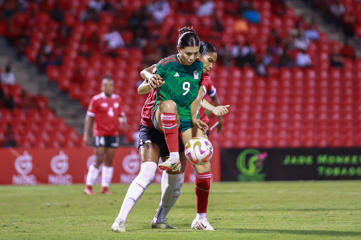 Trinidad and Tobago's Victoria Swift challenges Mexico's Kiana Palacios (#9) for the ball during a Road to W Gold Cup match at the Hasely Crawford Stadium, Port of Spain on Tuesday, December 5th 2023. 