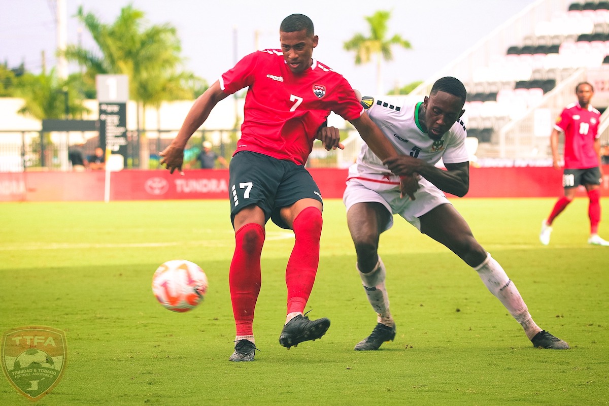 Trinidad and Tobago's Ryan Telfer (#7) holds off an opposing player during a Concacaf Gold Cup match against St. Kitts and Nevis at DRV PNK Stadium, Ft. Lauderdale, Florida on Sunday, June 23rd 2023.