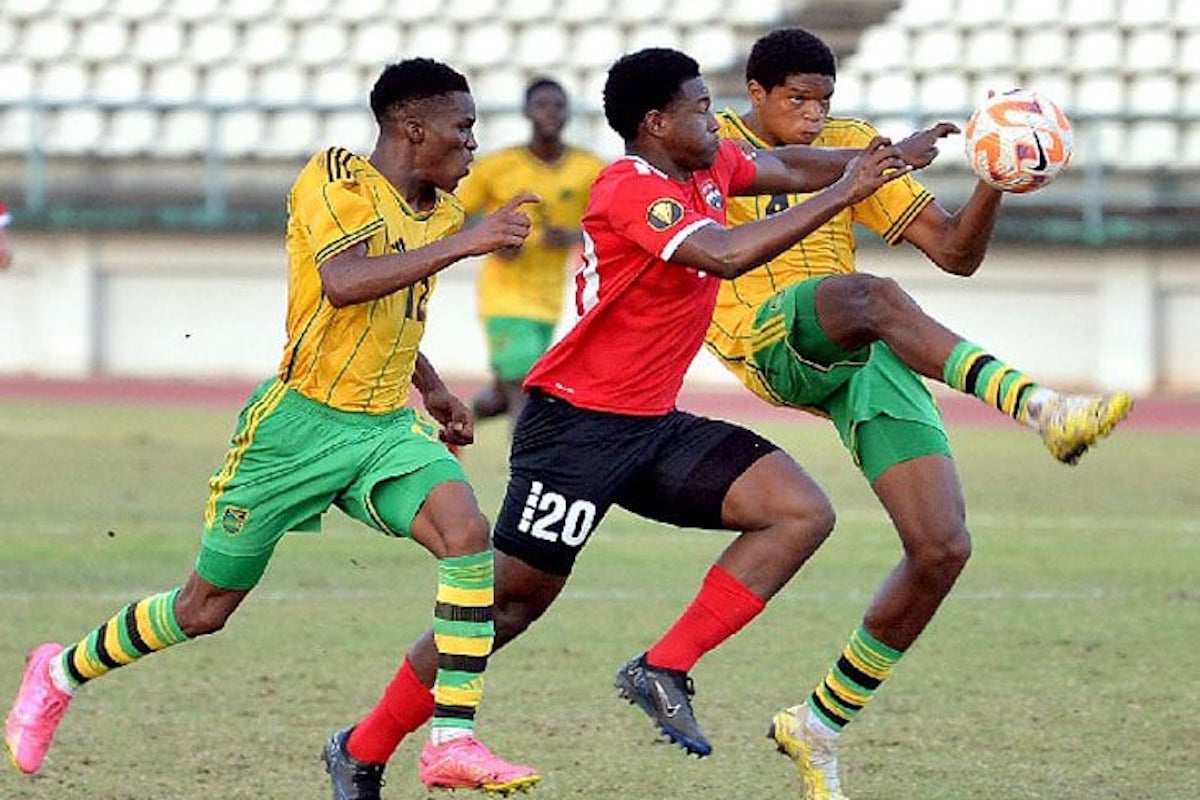 Trinidad and Tobago U-20 forward Addae Paponette tries to squeeze through Jamaica’s Christopher Ainsworth, left, and Michael Forbes during their international friendly on Thursday, February 1st 2024 at the Larry Gomes Stadium, Malabar, Arima. PHOTO BY: Robert Taylor