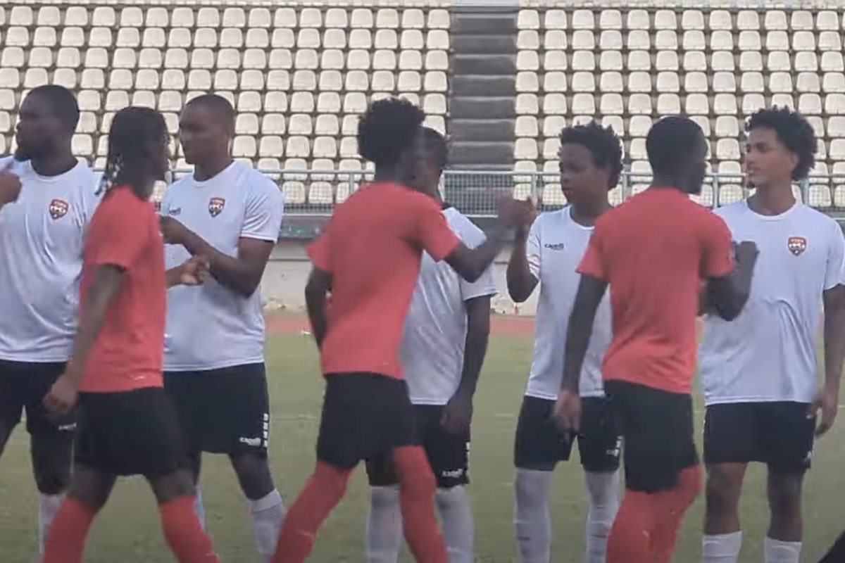 The Trinidad and Tobago Men's Senior team greet the T&T Men's U-20 team prior to a warmup match at Larry Gomes Stadium, Malabar on Thursday, February 8th 2024.