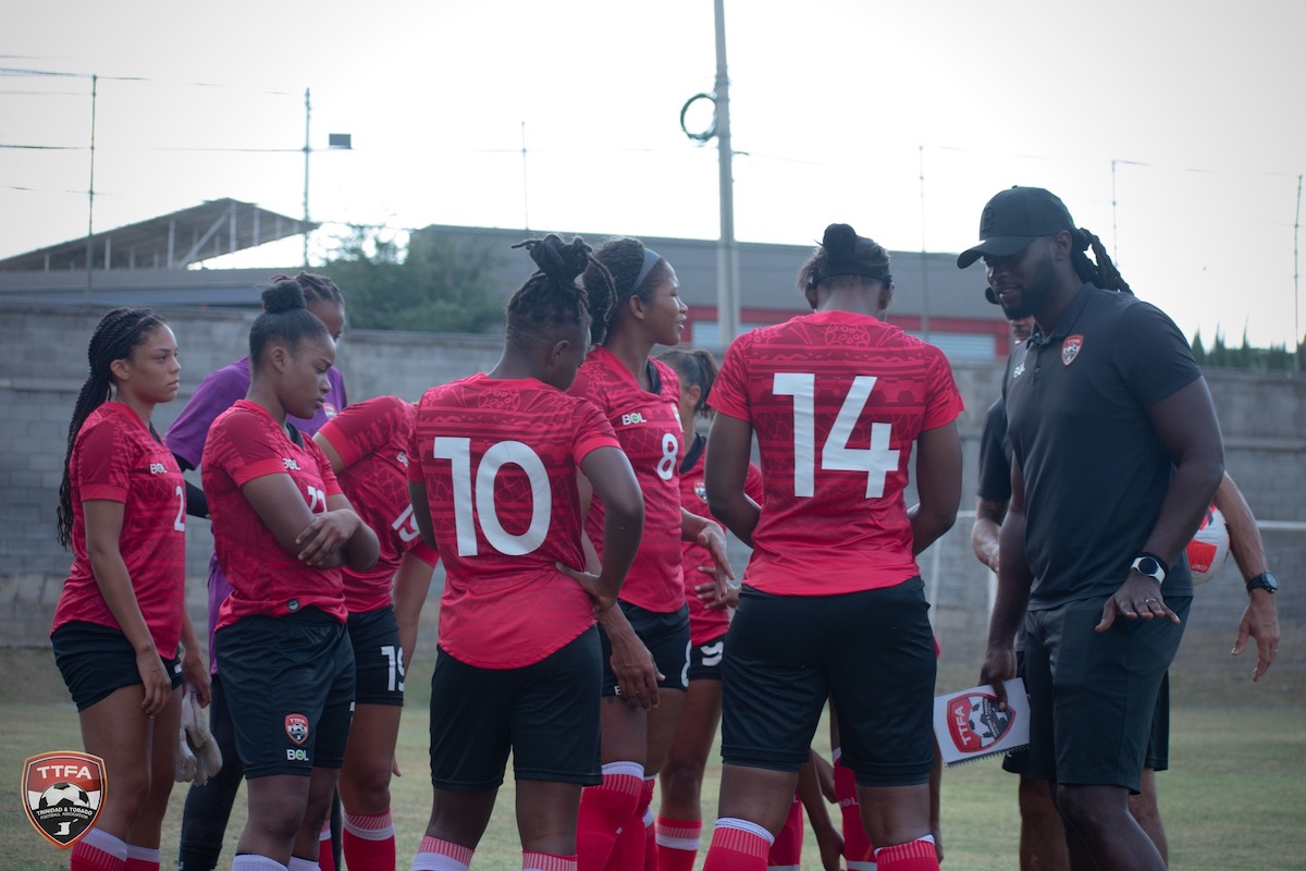 Trinidad and Tobago Women's Head Coach Kenwyne Jones gives instructions to his troops during an exhibition match against University of Monterrey on June 26th 2022.