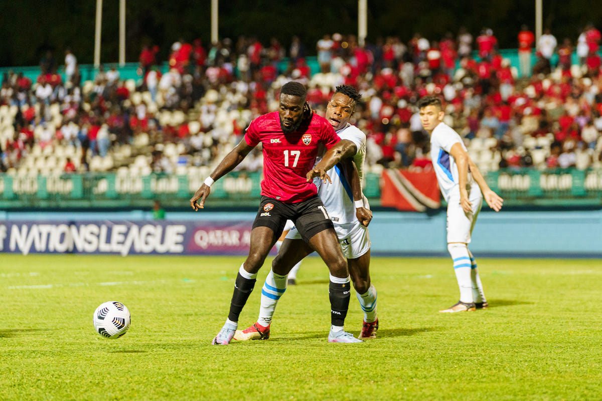 Trinidad and Tobago's Rundell Winchester (left) is challenged for the ball during a Concacaf Nations League Group C match against Nicaragua at Dwight Yorke Stadium, Bacolet, Tobago on Monday, March 27th 2023.