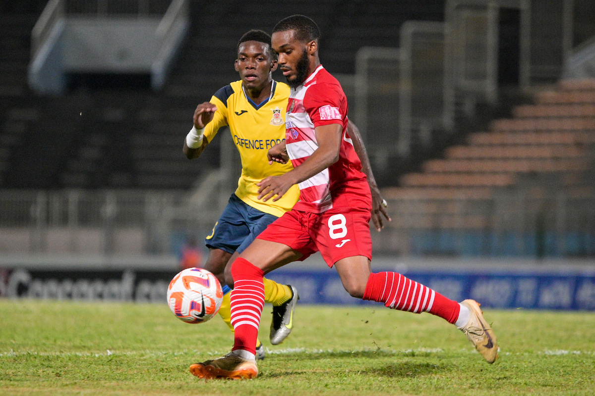Defence Force's Kaihim Thomas (left) challenges Golden Lion's Norman Grelet (#8) during a Caribbean Cup match at Stade-Pierre Aliker, Fort-de-France, Martinique on Wednesday, August 30th 2023.