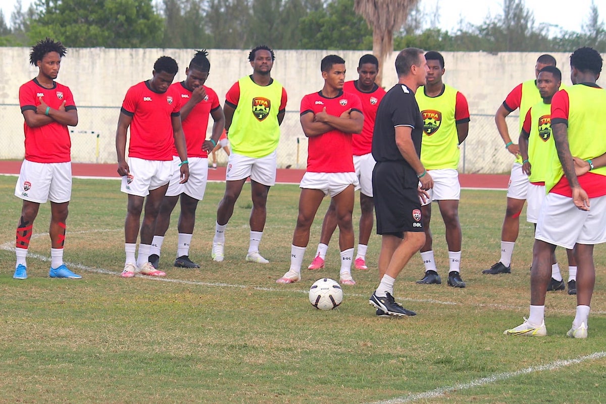 T&T men's football team coach Terry Fenwick (fifth from right) speaks to his squad during a training session at Nassau, Bahamas on Thursday. PHOTO: TTFA Media