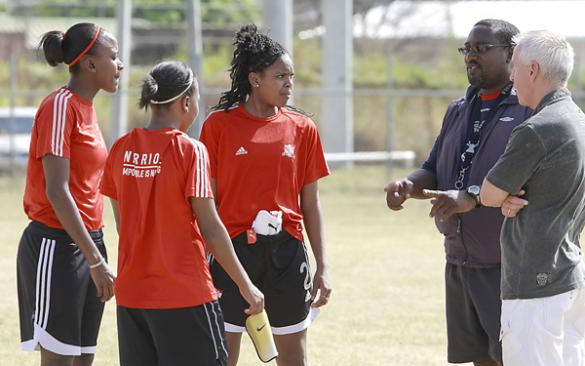 T&T senior women’s footballers, from left, Anastasia Prescot, Daniel Blaire and Ayana Russell listen to instructions from coach, Jamaal Shabazz, second from right, while technical director of women’s football in T&T and U-17 coach, Even Pellerud looks on. Photo: Anthony Harris.