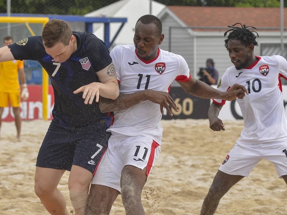 Trinidad and Tobago's Kevon Woodley (#11) challenges USA's Nicholas Perera (#7) for the ball during a 2021 Concacaf Beach Soccer match on Tuesday, May 18th 2021 in Alajuela, Costa Rica.