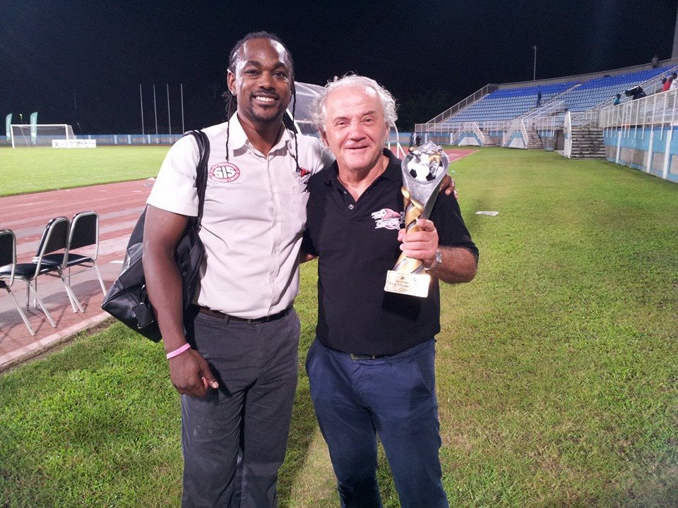 Central FC Managing Director Brent Sancho congratulates First Citizens Cup 2015 Best Coach Zoran Vranes on defending the trophy.