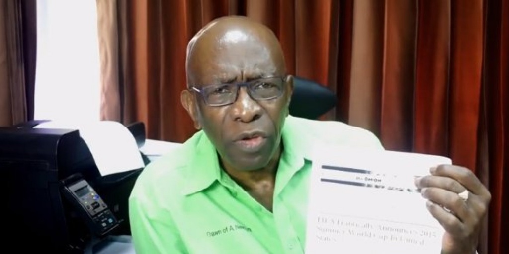 Jack Warner pointing to an article from the Onion