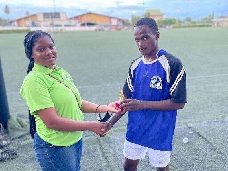 TOP PERFORMER: Karel Wells, of Chaguanas North, receives his Most Valuable Player award for his two-goal performance in their 2-1 win against Santa Cruz United, in last weekend’s action in the Crown Trace Under-18 Showcase Football League at the Centre of Excellence in Macoya.