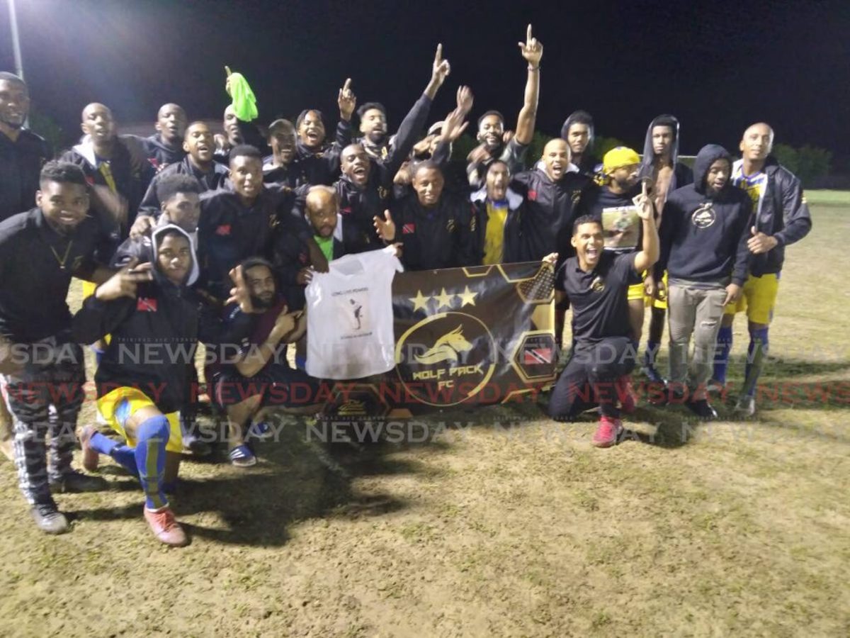 Wolf Pack FC members celebrate victory in the Sweet Sixteen Football League at the Ojoe Recreation Ground, Sangre Grande, Saturday July 30th 2022. PHOTO: Stephon Nicholas