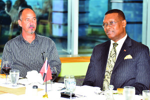 STATING THE PLAN: National coach Stephen Hart, left, and Trinidad and Tobago Football Association president Raymond Tim Kee at yesterday’s function at Trinidad Union Club, Nicholas Towers, Independence Square in Port of Spain. —Photo: STEPHEN DOOBAY