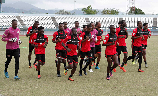 Members of the T&T football squad work out during a training session at the Larry Gomes Stadium in Malabar Arima yesterday